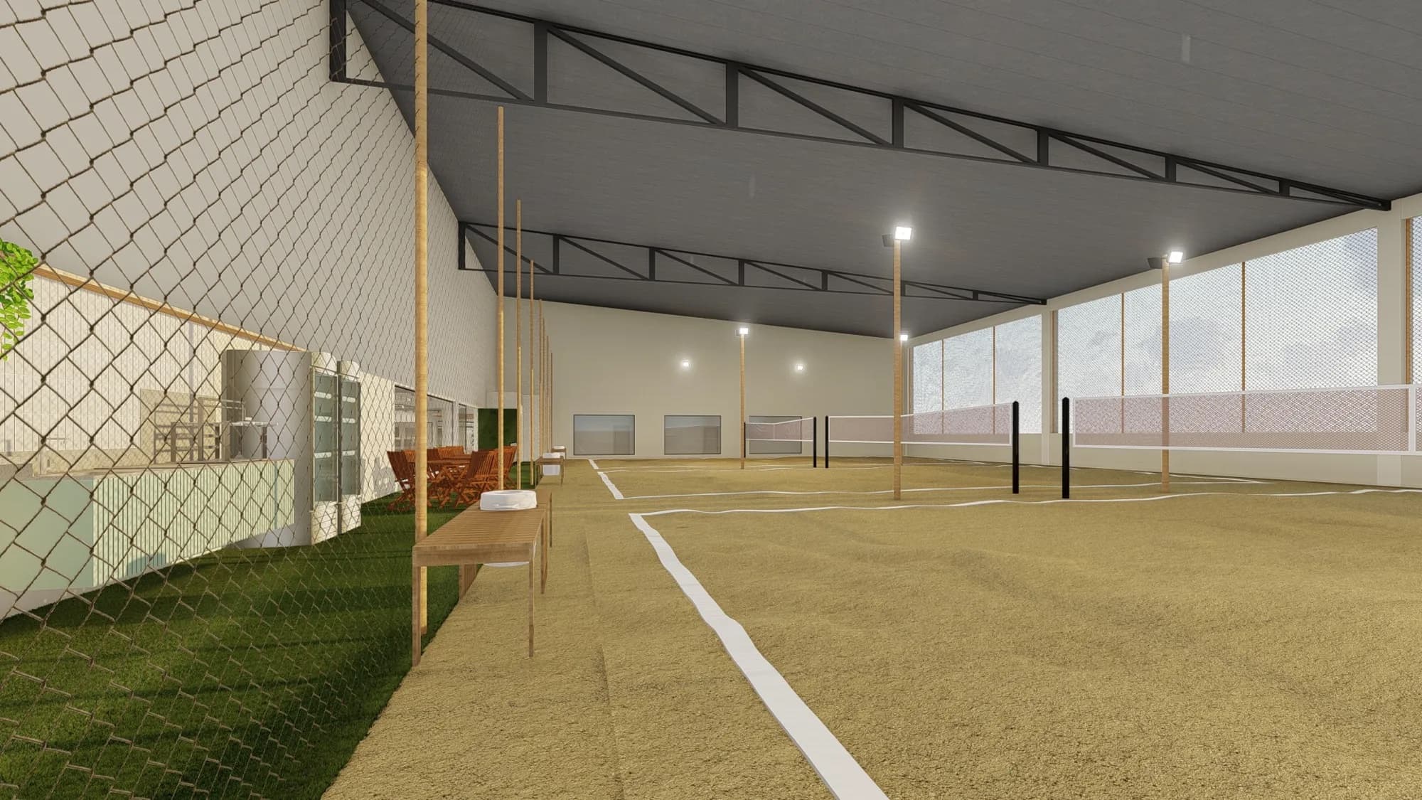 Quadras cobertas de beach tennis e pickleball com areia, redes, iluminação e área de convivência com mesas ao lado