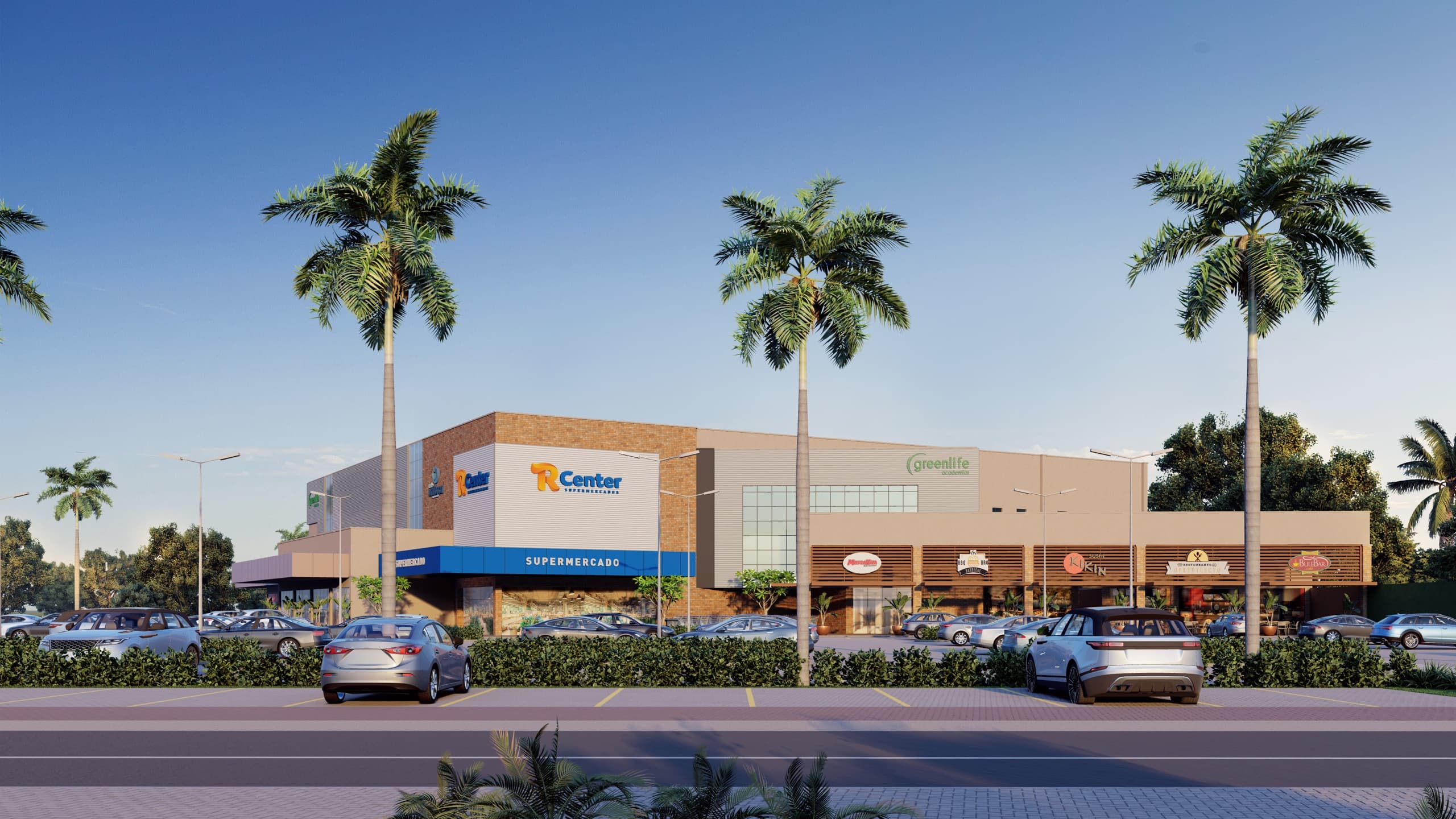 Vita Park Mall visto da avenida, com palmeiras, o R Center e o estacionamento em frente às lojas