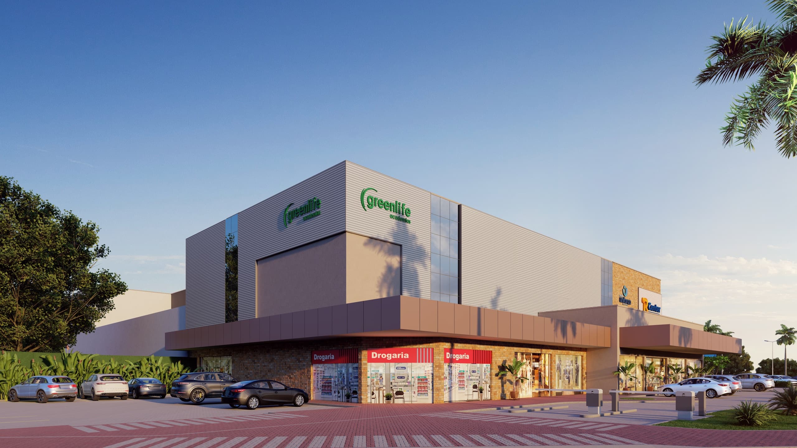 Esquina do Vita Park Mall com a Greenlife no alto, a drogaria e as lojas no térreo e carros estacionados em frente